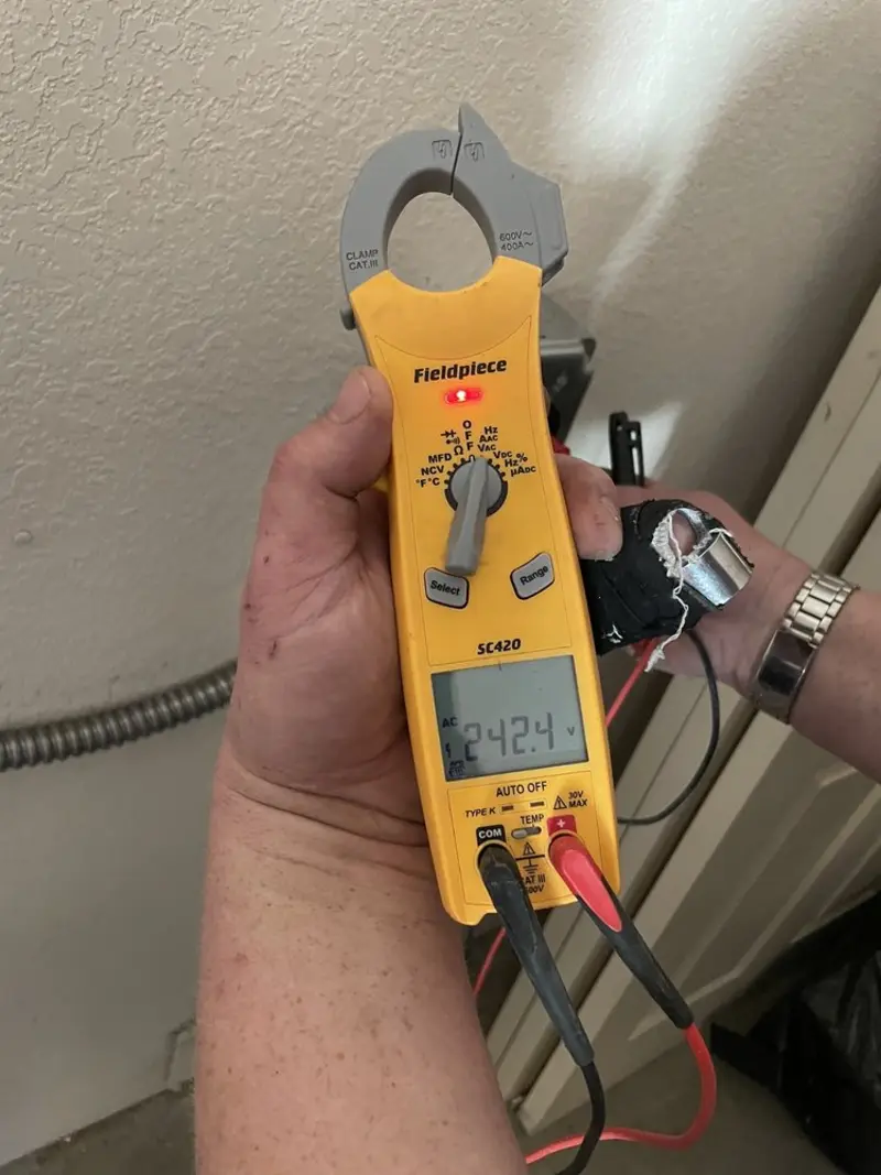 Voltage testing with clamp meter during Outlet Installation in Atlantic